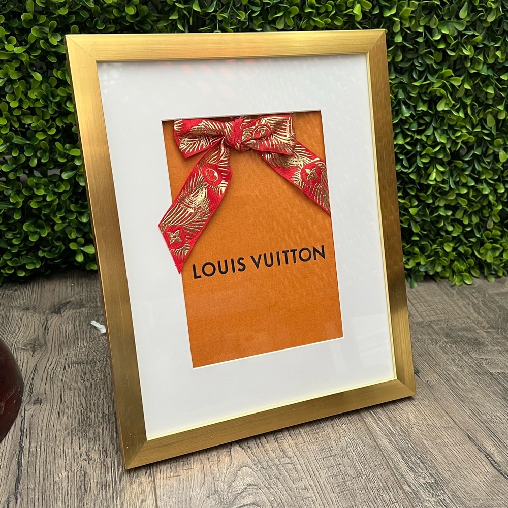 Louis Vuitton small shopping bag with red Chinese 2022 ribbon, in a frame